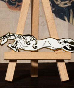 White unicorn enamel pin on mini easel